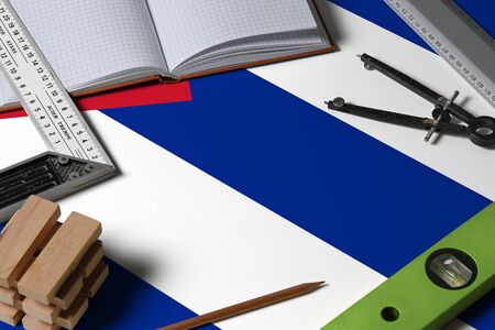 Cuba national flag on profession concept with architect desk and tools background. Top view mock-up.の写真素材
