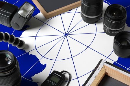 Antarctica national flag with top view of personal photographer equipment and tools on white wooden...