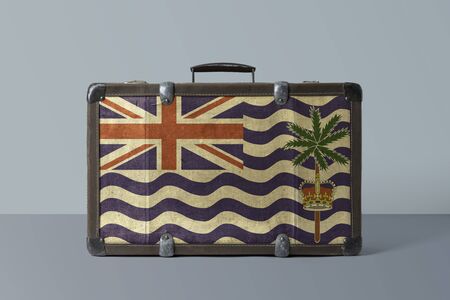 British Indian Ocean Territory flag on old vintage leather suitcase with national concept. Retro brown luggage with copy space text.の写真素材