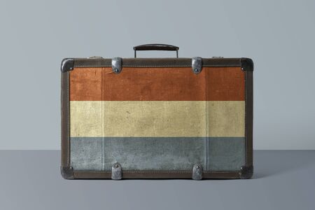 Luxembourg flag on old vintage leather suitcase with national concept. Retro brown luggage with copy space text.の写真素材