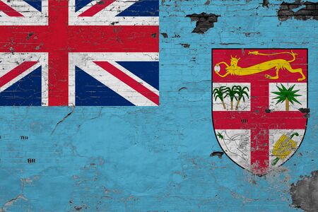 Fiji flag on grunge scratched concrete surface. National vintage background. Retro wall concept.の写真素材