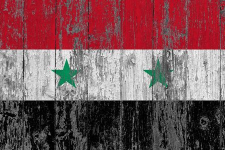 Syria flag on grunge scratched wooden surface. National vintage background. Old wooden table scratched flag surface.の写真素材