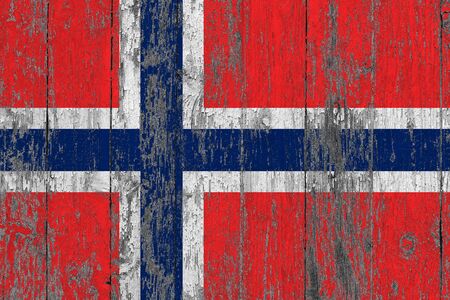 Bouvet Islands flag on grunge scratched wooden surface. National vintage background. Old wooden table scratched flag surface.の写真素材