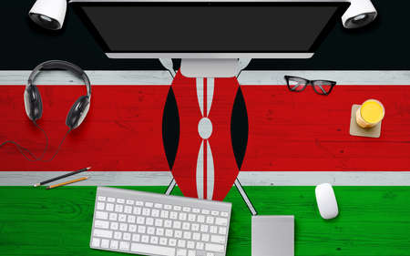 Kenya flag background with headphone,computer keyboard and mouse on national office desk table.Top view with copy space.Flat Lay.の写真素材