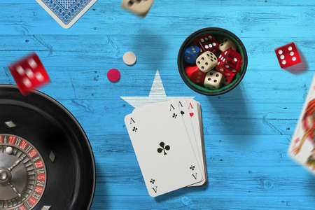Somalia casino theme. Aces in poker game, cards and chips on red table with national flag background. Gambling and betting.の写真素材
