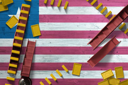 Iraq flag with national background with dominoes on wooden table. Top view. Concept of game.の写真素材