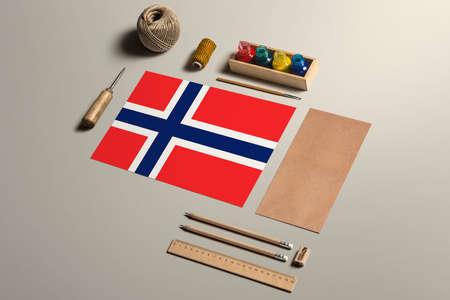 Bouvet Islands calligraphy concept, accessories and tools for beautiful handwriting, pencils, pens, ink, brush, craft paper and cardboard crafting on wooden table.の写真素材