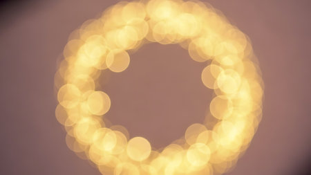 A circular arrangement of warm, glowing lights against a dark background, creating a soft and inviting ambiance.の素材