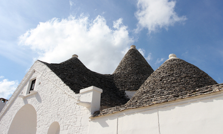 Alberobello, Puglia Region, South of Italy. Trulli di Alberobello.  Traditional roofs of the Trulli, original and old houses of this region.の写真素材