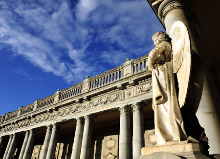 BOLOGNA, ITALY- DECEMBER 10,2017: Old statue of angel inside the monumental cemetery of the Certosa di Bologna. The public cemetery was established in 1801 using the pre-existing structure of the Certosa di San Girolamo di Casara, founded in the middle ofのeditorial素材
