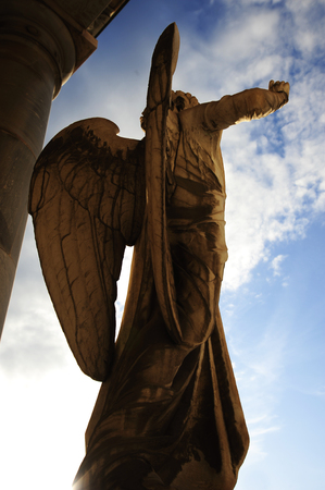 BOLOGNA, ITALY- DECEMBER 10,2017: Old statue of angel inside the monumental cemetery of the Certosa di Bologna. The public cemetery was established in 1801 using the pre-existing structure of the Certosa di San Girolamo di Casara, founded in the middle ofのeditorial素材