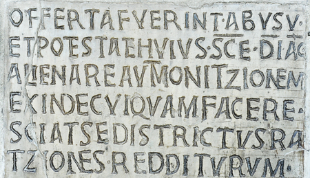 Latin inscription on ancient wall of Church of Santa Maria in Cosmedin in Rome, Italyのeditorial素材