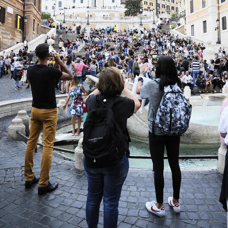 Rome, Italy, October 11, 2018: Three people are photographing with the phone in Piazza di Spagna in Romeのeditorial素材