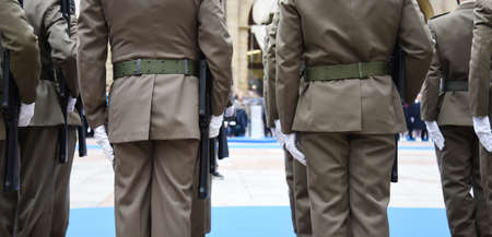 Soldiers lined up in the city square before performing the ceremony - The Army soldiers standing in...