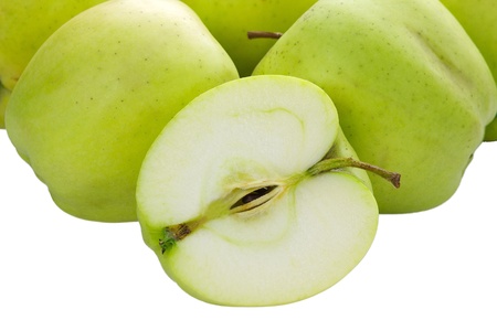 whole and sliced apples on a white backgroundの写真素材