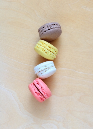 Colorful macaroons on wooden backgroundの写真素材