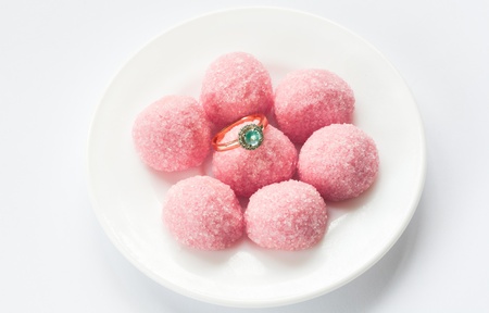 marmalade and pink engagement ring on a white plateの写真素材