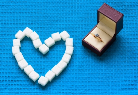 engagement ring and sugar heartsの写真素材