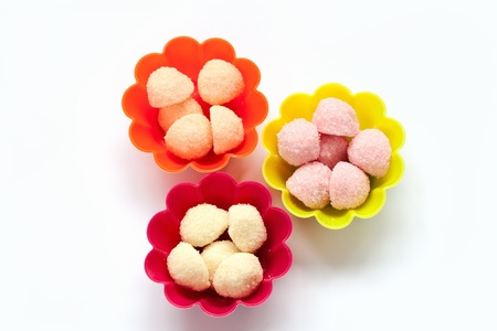 sweet jelly candies in cup cake cases on whiteの写真素材