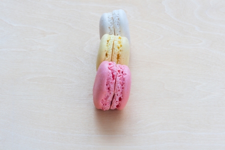 Colorful macaroons on wooden backgroundの写真素材