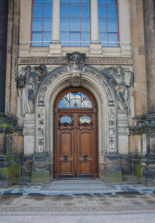 vintage wooden door with angel statues, Dresden, Saxony Germanyの写真素材