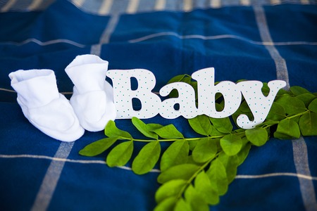 the inscription of white letters Baby with socksの写真素材