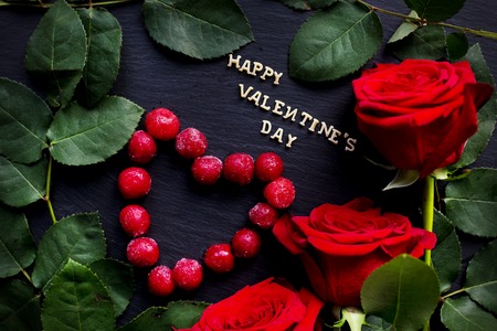 inscription Closeup of Valentine's day, cherry heart-shaped, red roses, rings