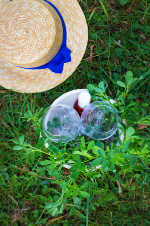 glasses in a wooden bucket on grass. Picnic. Summerの写真素材