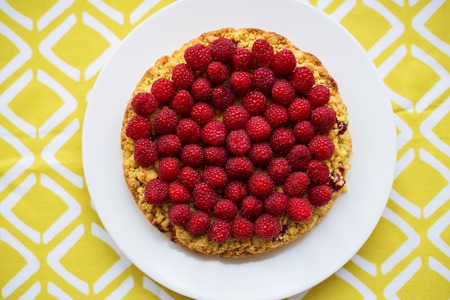 bright crimson-sand cake on yellow napkin, top viewの写真素材