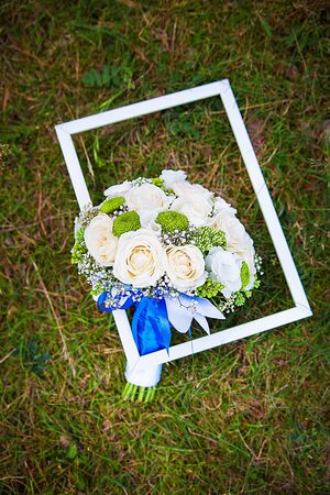 Colorful wedding bouquet on wooden frame outsideの写真素材