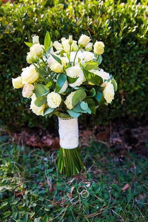 beautiful bridal bouquet lying on the green grassの写真素材