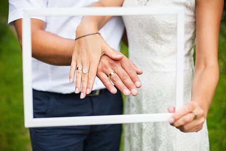 beautiful hands newlyweds display their wedding ringsの写真素材