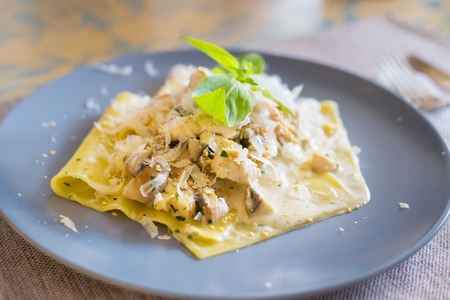 delicious macaroni pasta on a plate in a restaurantの写真素材