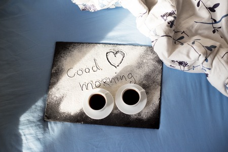 good morning inscription flour on a board with cups of coffee, heart Valentine's dayの写真素材