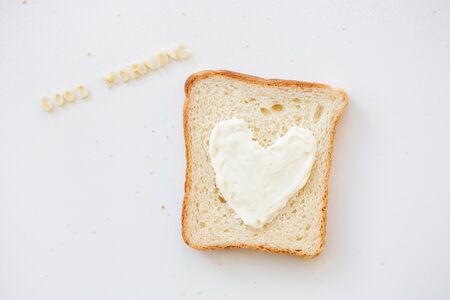 sandwich for breakfast in the form of heart with cheese - good morning inscriptionの写真素材