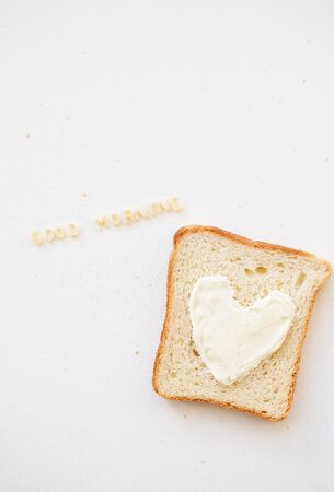 sandwich for breakfast in the form of heart with cheese - good morning inscriptionの写真素材