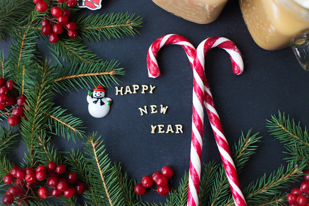 Christmas holiday background with hot cocoa and candy. The inscription Happy New Year.の写真素材