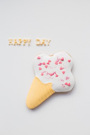 cookie ice cream in the form of hearts with inscription happy day.の写真素材