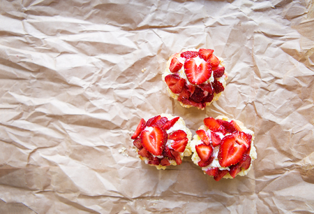 Beautiful and bright cupcakes with strawberries, delicious and simple.の写真素材