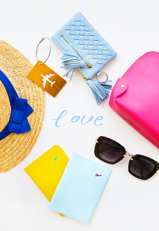 Preparation for vacation - hat, glasses, passport, cosmetic bag, purse Inscription-loveの写真素材