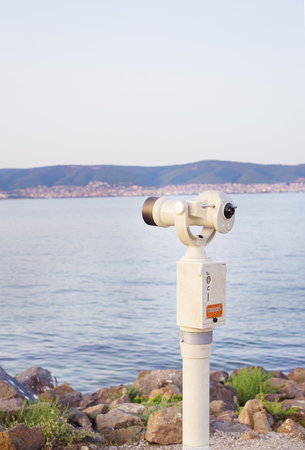 Telescope on the sea-summer, sun, sea beachの写真素材