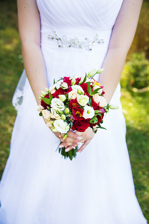 bride in white dress holding a bouquet.の写真素材
