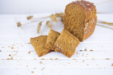 Sliced rye bread on a cutting board close-up.の写真素材