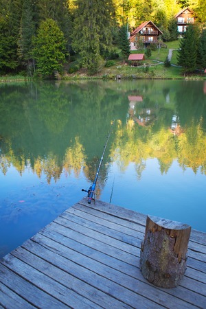 fishing on the lake in a beautiful autumn forest.