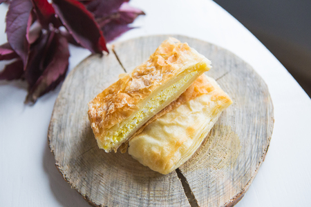 Very tasty juicy bun with cheese, close-upの写真素材