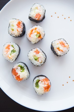 Delicious fresh sushi on a white plate, close-upの写真素材