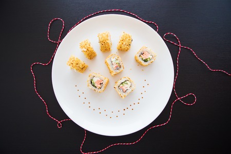 Fresh tasty sushi on a white plate close up. View from aboveの写真素材