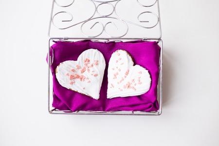 Cookies in the form of heart on a pink napkin.の写真素材
