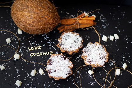 coconut muffins on a black background inscription love coconuts, close-upの写真素材