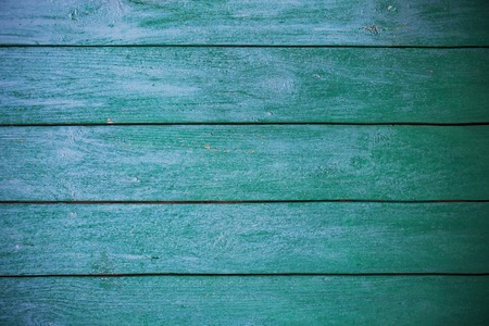 Shabby and very old green-blue wooden fence.の写真素材